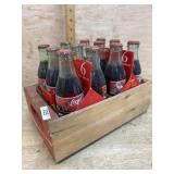 Wood crate with Coca Cola Santa bottles