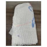 White and blue chenille bedspread