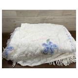 White and blue chenille bedspread