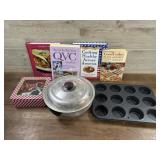 Box of cookbooks and baking pans