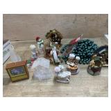 Box of holiday ornaments and beaded garlands