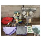 Box of candles, curtain holders, and vases