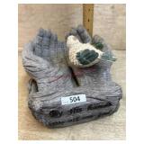 By his hands they are Fed bird feeder