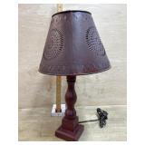 Table lamp with metal punched shade
