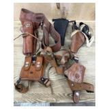 Flat of leather and synthetic holsters