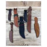 Flat of seven leather knife sheaths