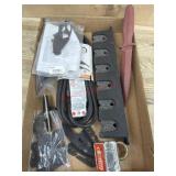 Box of rubber knife. Extension cord.