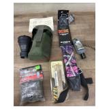 Flat of rifle strap. Facepaint. Magnifier.