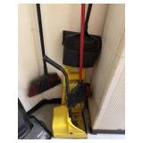lot of brooms, dust pans, and wet floor