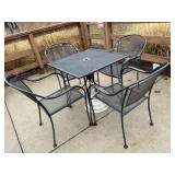 4 top rod iron patio table with an umbrella stand