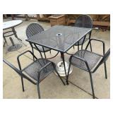 4 top rod iron patio table with an umbrella stand