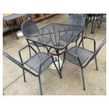 4 top rod iron patio table with an umbrella stand
