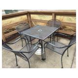 4 top rod iron patio table with an umbrella stand