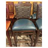 2- Wood bar stools with green seats and backs