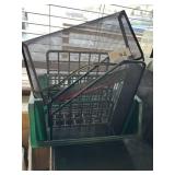 Green basket and metal office desk sorters
