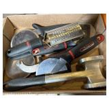 Flat of pizza cutters , grater, and meat