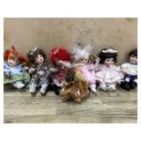 6- Marie Osmond porcelain cupcake dolls  one