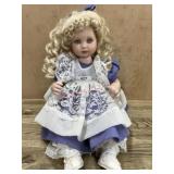 Marie Osmond Porcelain 16 inch doll in purple and
