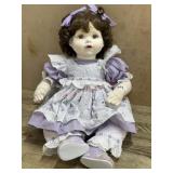 18 inch Soft body doll in purple dress