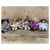 6 Marie Osmond porcelain cupcake dolls  one in