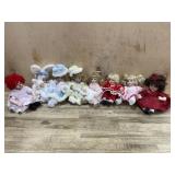 Flat with 8 Marie Osmond porcelain cupcake dolls