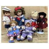 Flat with 2 porcelain and 4 vinyl 7 inch dolls