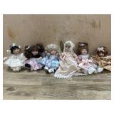 6- Marie Osmond porcelain cupcake dolls  in