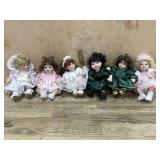 6- Marie Osmond porcelain cupcake dolls in green