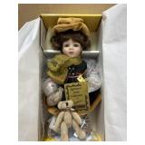 Seymor Mann porcelain doll with teddy bear