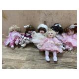 6- Marie Osmond porcelain cupcake dolls  in pink,