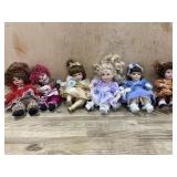 6- Marie Osmond porcelain cupcake dolls  clown,