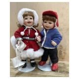 2- Porcelain 10 dolls on stands dressed in winter