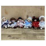 6- Marie Osmond porcelain cupcake dolls in blue