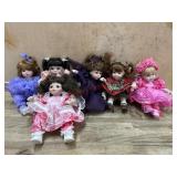 6- Marie Osmond porcelain cupcake dolls  in