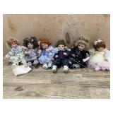 6- Marie Osmond porcelain cupcake dolls  one in