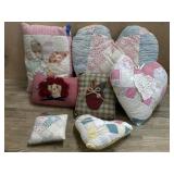 Box lot of quilted pillows