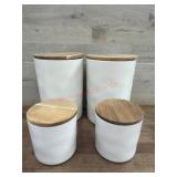 Four Ceramic Canisters With Wood Lids