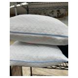 Shelf of Assorted Blankets, Pillows, and Dog Bed