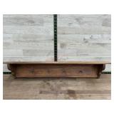 Wooden shelf w/ pegs