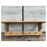 Wooden shelf w/ pegs