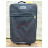Black suitcase with travel and tote bags