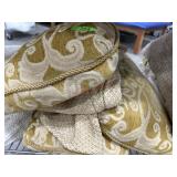 Gold and beige throw pillows and sofa arm covers