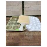Muffin tin. Cutting board and egg tray