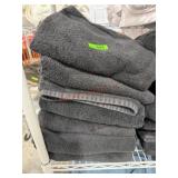 Stack of black bath towels