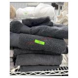 Stack of black bath towels