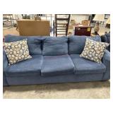 Blue sofa with decorator throw pillows