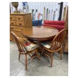 Round oak dining table with 2 arrow back chairs