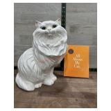 Ceramic cat statue and cat book