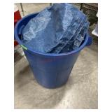 Blue trash can of tarps