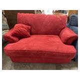 Red Klaussner loveseat with pull out sleeper